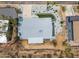 Aerial view showcases the roof, desert surroundings, and nearby properties at 1701 E Camino Del Santo --, Phoenix, AZ 85022