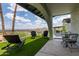 Landscaped backyard with artificial turf, mountain views, and outdoor seating at 1701 E Camino Del Santo --, Phoenix, AZ 85022