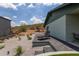 Beautiful backyard featuring desert landscaping and paver patio with lounge chair at 1701 E Camino Del Santo --, Phoenix, AZ 85022