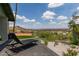 Patio area with lounge chair overlooking city and mountain views at 1701 E Camino Del Santo --, Phoenix, AZ 85022
