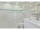 Bright bathroom featuring white tile, glass enclosed shower, and modern fixtures at 1701 E Camino Del Santo --, Phoenix, AZ 85022