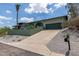 Beautiful home featuring desert landscaping and a lengthy concrete driveway at 1701 E Camino Del Santo --, Phoenix, AZ 85022