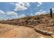 Dirt lot with rock wall and native desert vegetation at 1701 E Camino Del Santo --, Phoenix, AZ 85022