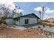 Charming home featuring a patio, desert landscaping, and a sliding glass door at 1701 E Camino Del Santo --, Phoenix, AZ 85022