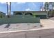 Home with a long driveway, a brick facade, desert landscaping at 1701 E Camino Del Santo --, Phoenix, AZ 85022