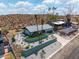Aerial image showcasing desert landscaping, mature palm trees, an updated home, and a two-car garage at 1701 E Camino Del Santo --, Phoenix, AZ 85022
