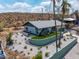 Aerial view of an updated home boasting a large yard, desert landscaping, and charming curb appeal at 1701 E Camino Del Santo --, Phoenix, AZ 85022