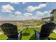 Inviting patio with Adirondack chairs and stunning city views at 1701 E Camino Del Santo --, Phoenix, AZ 85022