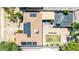Aerial view of the home's roof, solar panels, patio, green backyard, and driveway at 1814 W Thomas Rd, Phoenix, AZ 85015