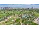 Sweeping aerial view of an amusement park, green spaces and city skyline offering a blend of entertainment and urban scenery at 1814 W Thomas Rd, Phoenix, AZ 85015