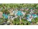 Overhead view showcases a charming amusement park featuring unique architecture, rides, and landscaped grounds at 1814 W Thomas Rd, Phoenix, AZ 85015