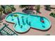 Aerial view captures a vibrant splash pad featuring playful water structures and colorful designs in a park setting at 1814 W Thomas Rd, Phoenix, AZ 85015