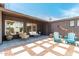 Private backyard offers outdoor seating, a patio, and unique wall art at 1814 W Thomas Rd, Phoenix, AZ 85015