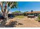 This yard features a swim spa, green lawn, trees, and patio, perfect for relaxation and entertainment at 1814 W Thomas Rd, Phoenix, AZ 85015