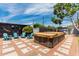 Relaxing backyard with a covered hot tub and comfortable seating area at 1814 W Thomas Rd, Phoenix, AZ 85015