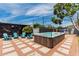 Inviting backyard with a modern hot tub and ample seating for entertaining at 1814 W Thomas Rd, Phoenix, AZ 85015