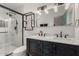 Modern bathroom features double sinks, marble countertops, and a sleek glass shower at 1814 W Thomas Rd, Phoenix, AZ 85015