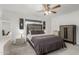 Bedroom with ceiling fan, neutral color scheme, and decorative furnishings at 1814 W Thomas Rd, Phoenix, AZ 85015