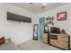 Cozy bedroom features a large window, plush carpet, and a mirror at 1814 W Thomas Rd, Phoenix, AZ 85015
