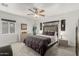 Bright bedroom featuring soft carpet, a large bed, and a dresser by the window at 1814 W Thomas Rd, Phoenix, AZ 85015