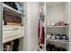 Walk-in closet with custom shelving and ample storage space for clothes and accessories at 1814 W Thomas Rd, Phoenix, AZ 85015