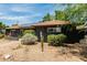 Charming home featuring xeriscape landscaping, solar panels, and a well-maintained exterior at 1814 W Thomas Rd, Phoenix, AZ 85015