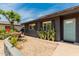 This home has a desert landscaped yard with beautiful plants and a fountain at 1814 W Thomas Rd, Phoenix, AZ 85015