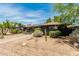 Attractive home featuring xeriscape landscaping, a walkway to the entrance, and solar panels at 1814 W Thomas Rd, Phoenix, AZ 85015
