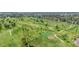 Expansive golf course view featuring lush green fairways, mature palm trees, and strategically placed sand bunkers at 1814 W Thomas Rd, Phoenix, AZ 85015