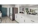 Open concept kitchen with stylish cabinets, and views into dining and living areas at 1814 W Thomas Rd, Phoenix, AZ 85015