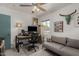 Bright office with a sleek desk, sofa, and modern decor for a comfortable workspace at 1814 W Thomas Rd, Phoenix, AZ 85015