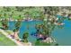 Aerial view of serene pond featuring a tropical island and crystal clear water at 1814 W Thomas Rd, Phoenix, AZ 85015