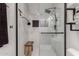 Contemporary shower with sleek glass door and marble tile at 1814 W Thomas Rd, Phoenix, AZ 85015