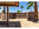 Enclosed backyard area featuring desert landscaping, block fence and gated entry for added privacy and security at 18899 N 77Th Ave, Glendale, AZ 85308