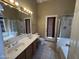 Bathroom includes double sink vanity, soaking tub and separate glass-enclosed shower at 18899 N 77Th Ave, Glendale, AZ 85308