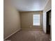 This bedroom features neutral walls, carpet flooring, and a window with blinds at 18899 N 77Th Ave, Glendale, AZ 85308