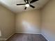 This bedroom features neutral walls, carpet flooring, and a ceiling fan at 18899 N 77Th Ave, Glendale, AZ 85308