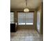 Sunny breakfast nook area with a back entrance, granite countertops and bright window at 18899 N 77Th Ave, Glendale, AZ 85308