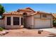 Charming single-story home with desert landscaping, tile roof, and a two-car garage at 18899 N 77Th Ave, Glendale, AZ 85308