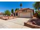 Charming single-story home with desert landscaping, tile roof, and a two-car garage at 18899 N 77Th Ave, Glendale, AZ 85308