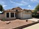 Charming single-story home with tile roof and well-maintained landscaping at 18899 N 77Th Ave, Glendale, AZ 85308