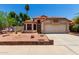 Charming single-story home with desert landscaping, tile roof, and a two-car garage at 18899 N 77Th Ave, Glendale, AZ 85308