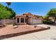 Charming single-story home with desert landscaping, tile roof, and a two-car garage at 18899 N 77Th Ave, Glendale, AZ 85308