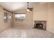 Bright living room features a brick fireplace and plenty of natural light at 18899 N 77Th Ave, Glendale, AZ 85308