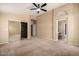 Large main bedroom with ceiling fan and closet with mirrored doors at 18899 N 77Th Ave, Glendale, AZ 85308