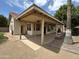 This backyard features a patio, a brown lawn, and a light brown house at 18899 N 77Th Ave, Glendale, AZ 85308
