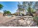 Beautiful backyard with a refreshing pool, mature trees, and a spacious seating area at 2016 S 102Nd Ln, Tolleson, AZ 85353