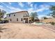 A spacious backyard showcasing the home's exterior, a pool, and ample space for outdoor activities at 2016 S 102Nd Ln, Tolleson, AZ 85353