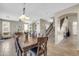 Spacious dining room with an elegant table set and seamless connection to other living areas at 2016 S 102Nd Ln, Tolleson, AZ 85353