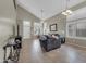 Inviting living room featuring high ceilings, lots of natural light, and tile floors at 2016 S 102Nd Ln, Tolleson, AZ 85353